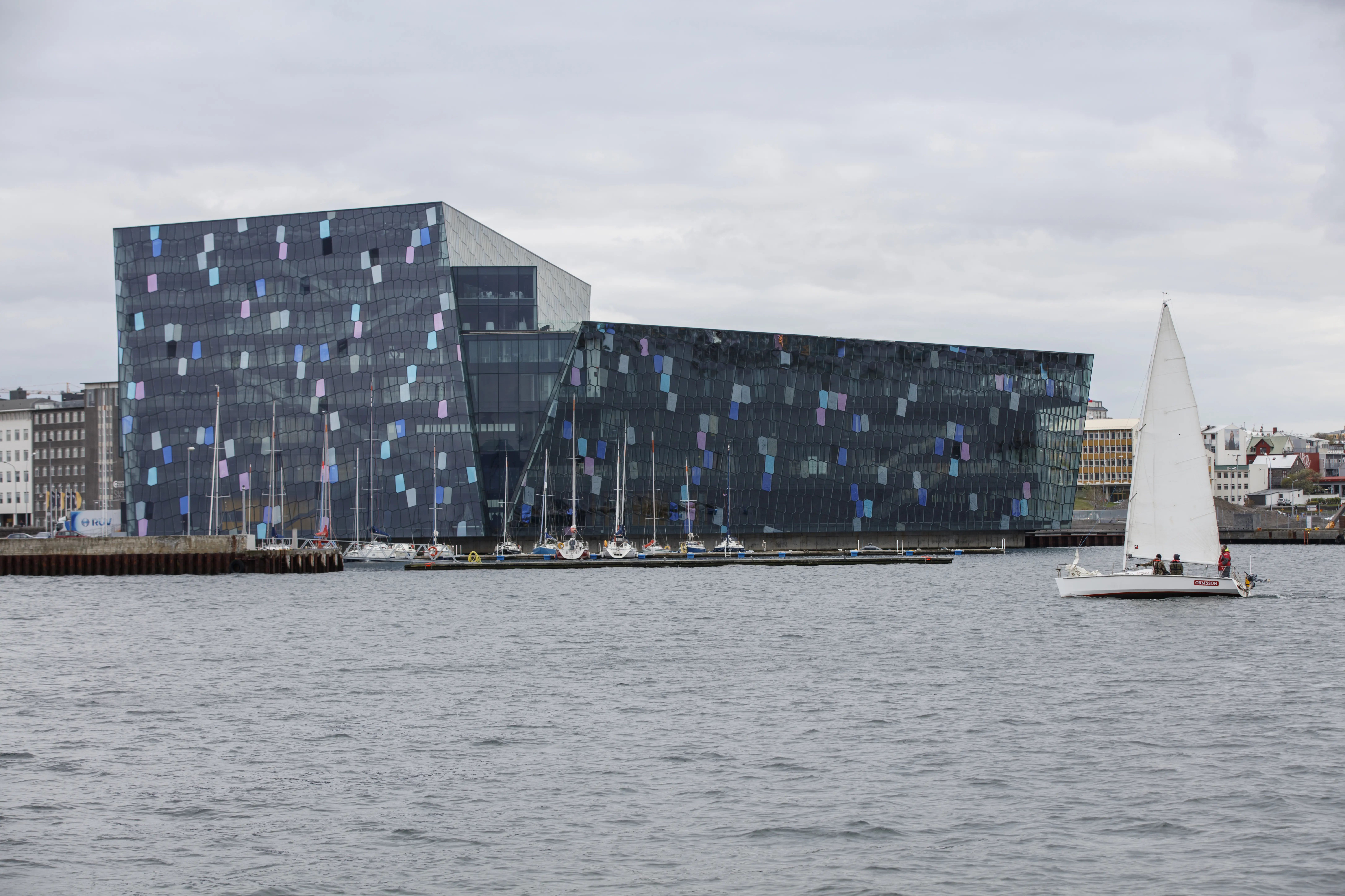Indigenous people with a traditional outrigger canoe on a beach